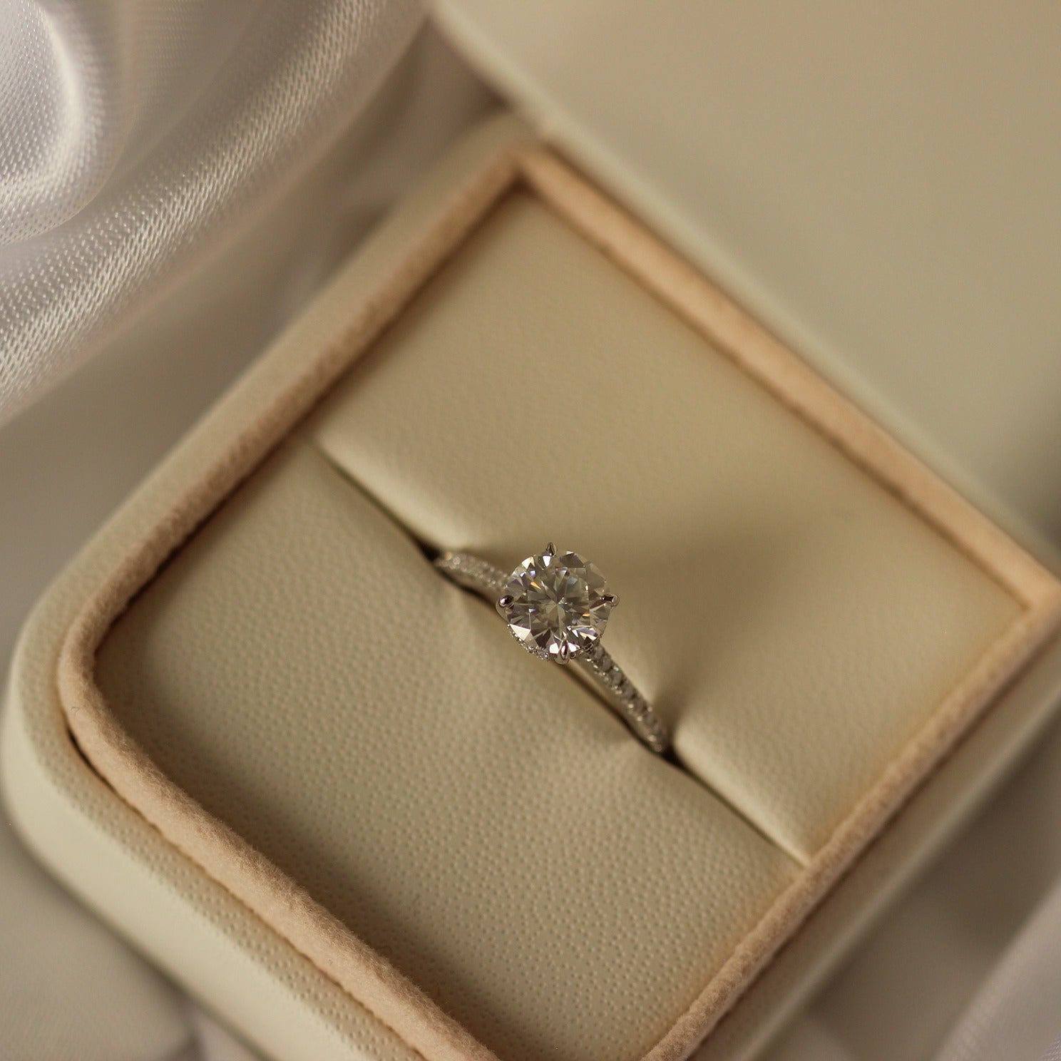 1 carat round moissanite pave ring in proposal ring box