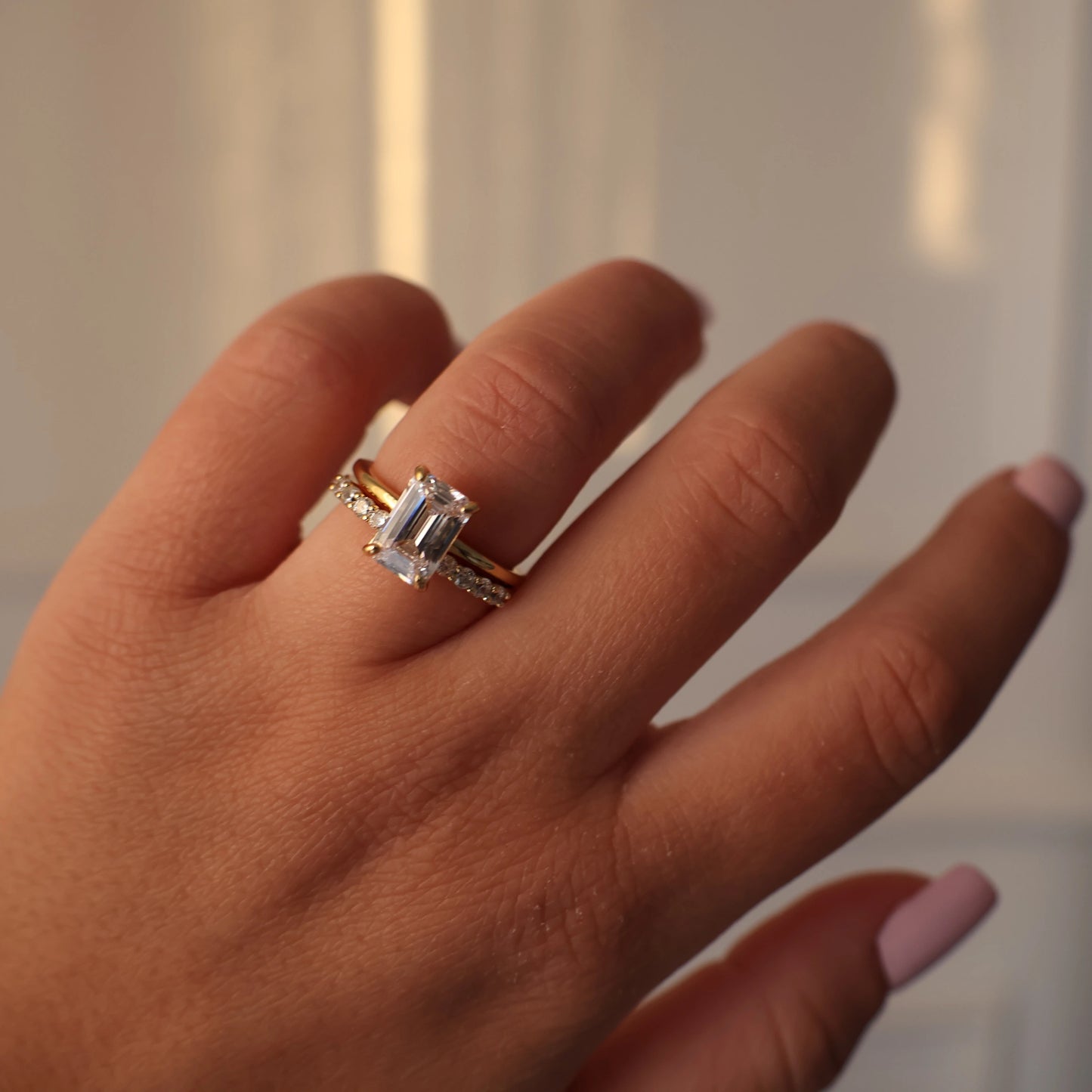 2 carat emerald cut 14k cubic zirconia ring stacked with eternity ring