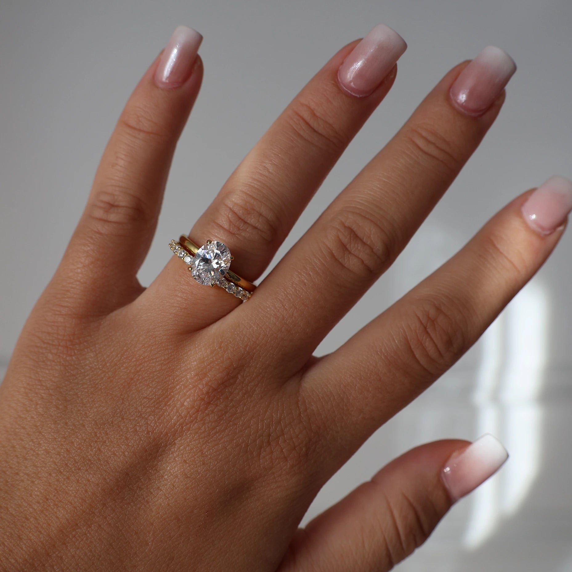 Gold oval shaped cubic zirconia solitaire ring with 2 carat center stone