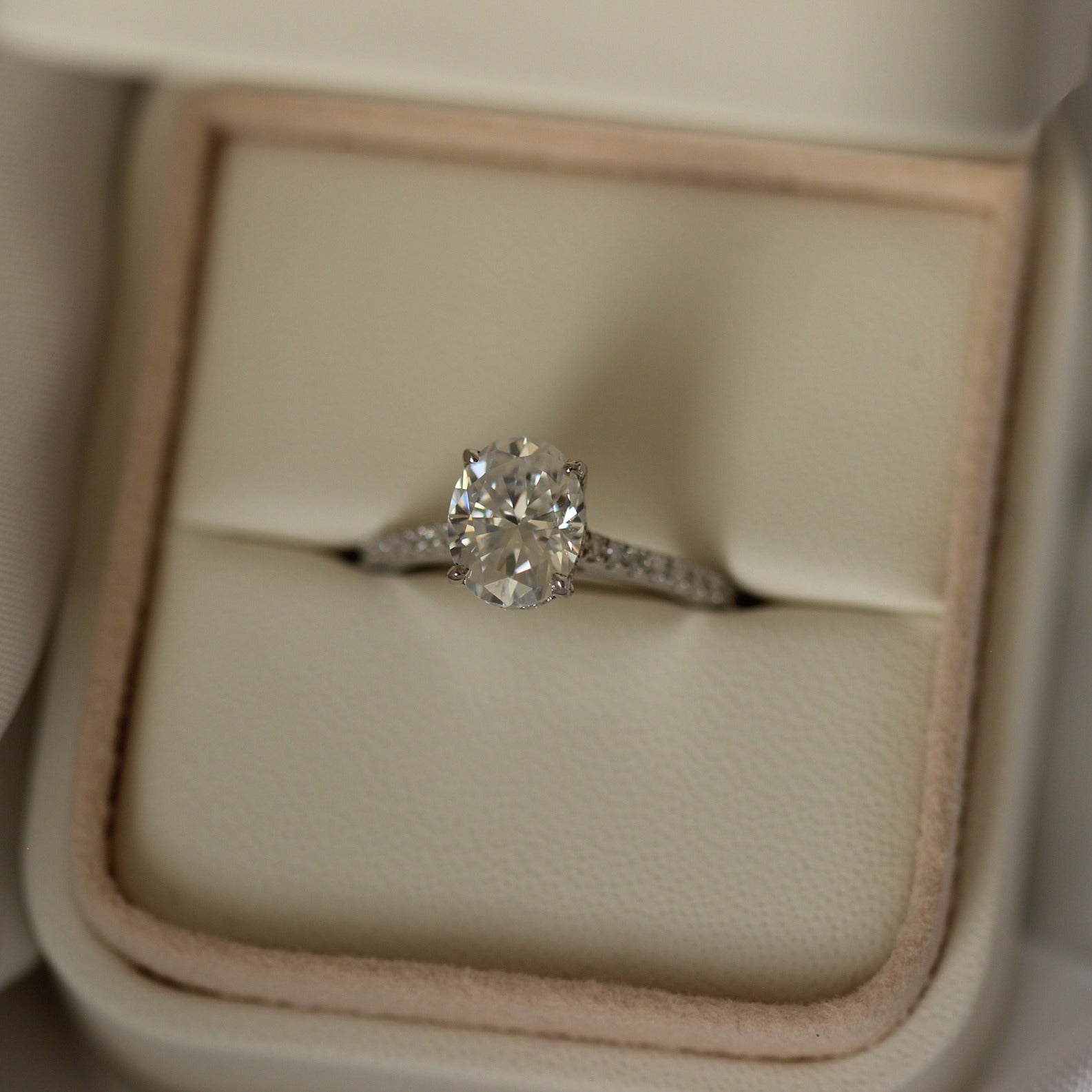 2 carat oval-cut moissanite wedding ring with pavé band