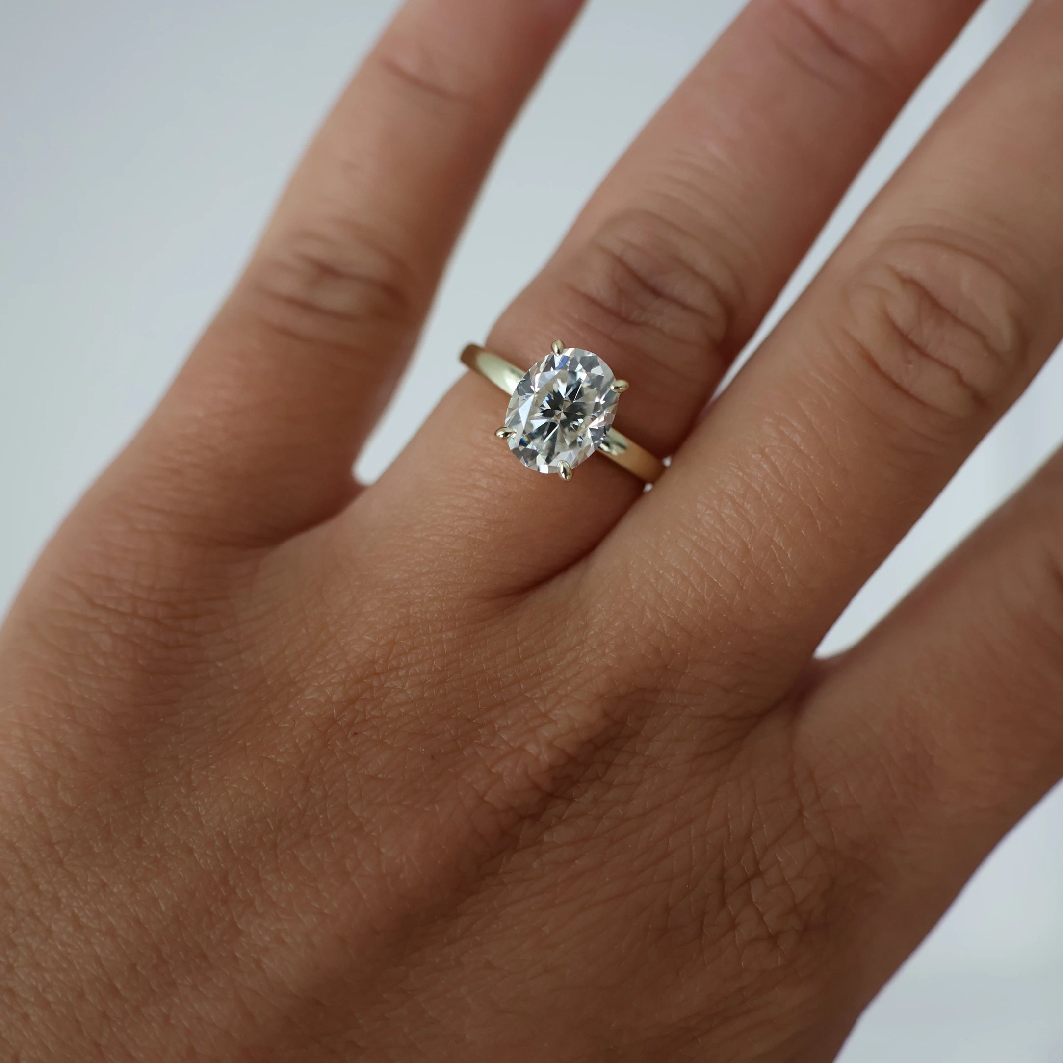 2 carat oval moissanite ring in light 14k gold filled