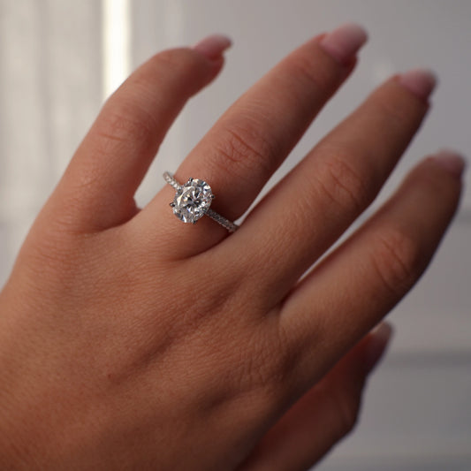 2 carat oval moissanite ring with pave band in silver