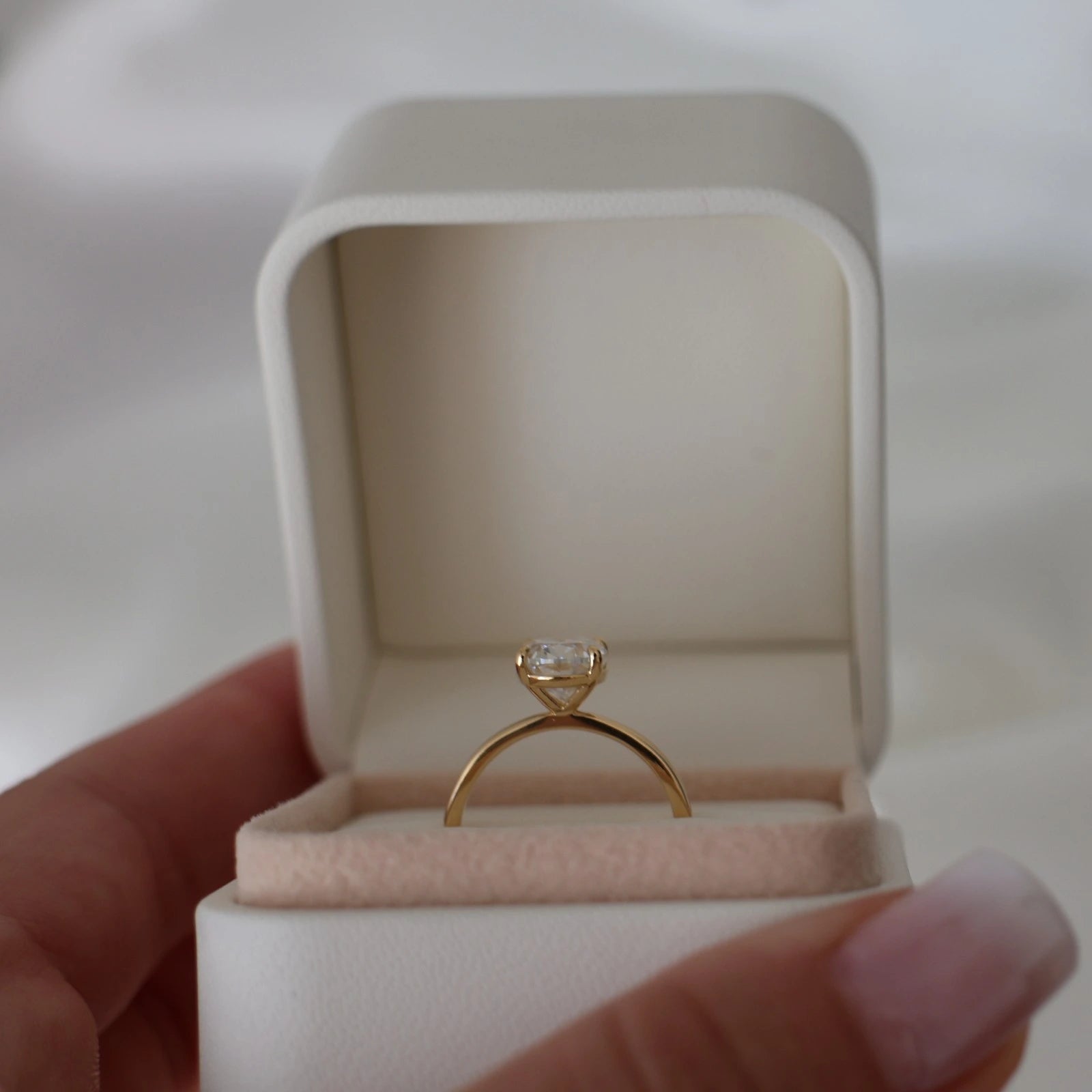 2 carat oval moissanite solitaire ring in 14k gold filled displayed in proposal box