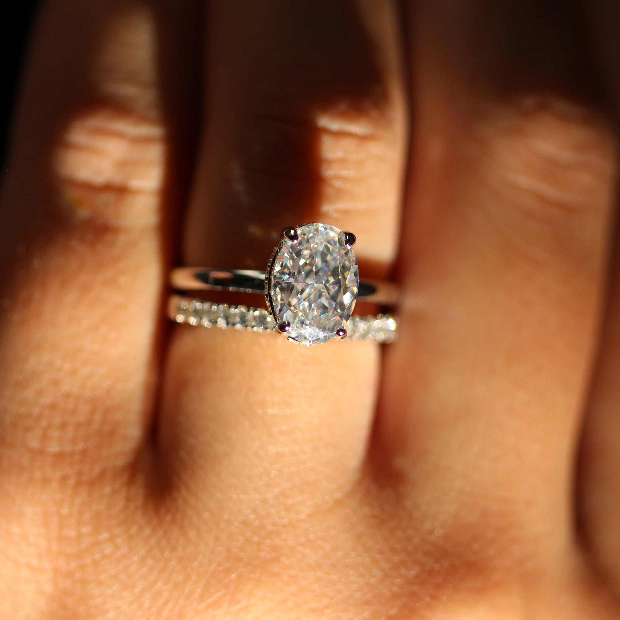 front view of 2 carat silver oval ring stacked with eternity band