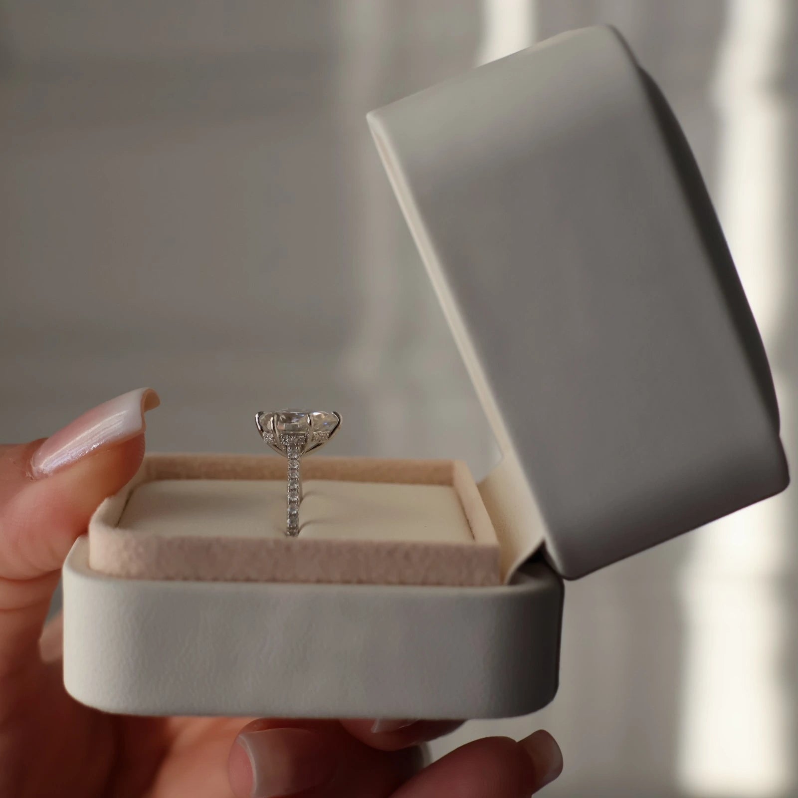 2 ct pear moissanite silver ring with hidden halo in engagement ring box