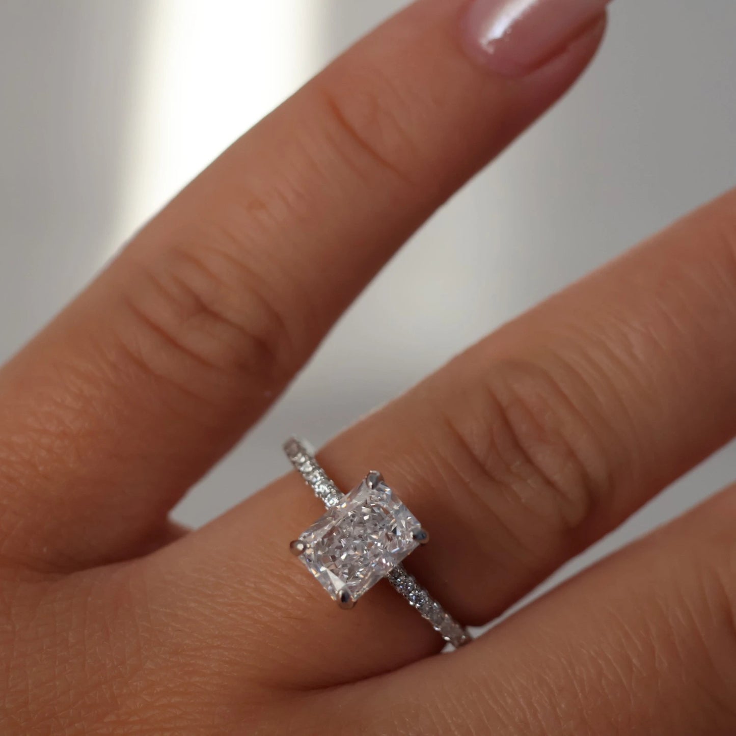 2 ct radiant CZ ring with pavé band