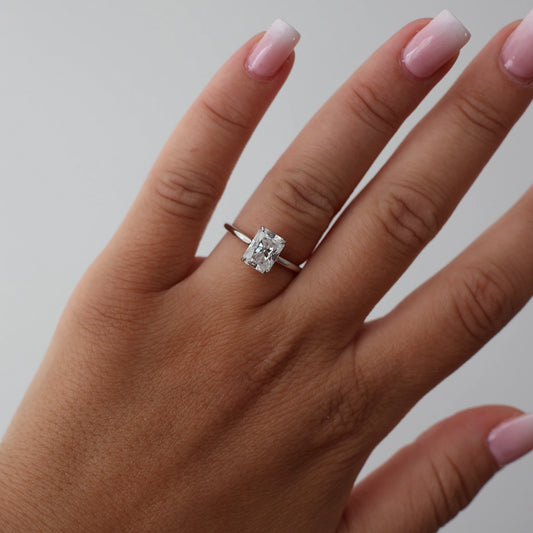 2 carat radiant cut moissanite ring in silver with a hidden halo