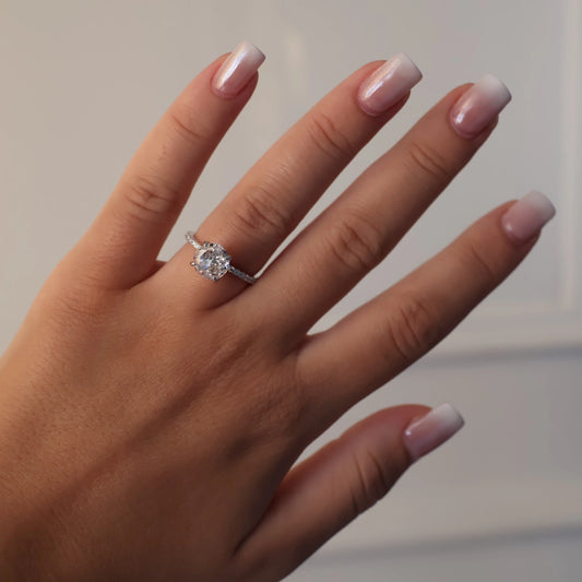 2 carat round cut ring with a silver pavé band