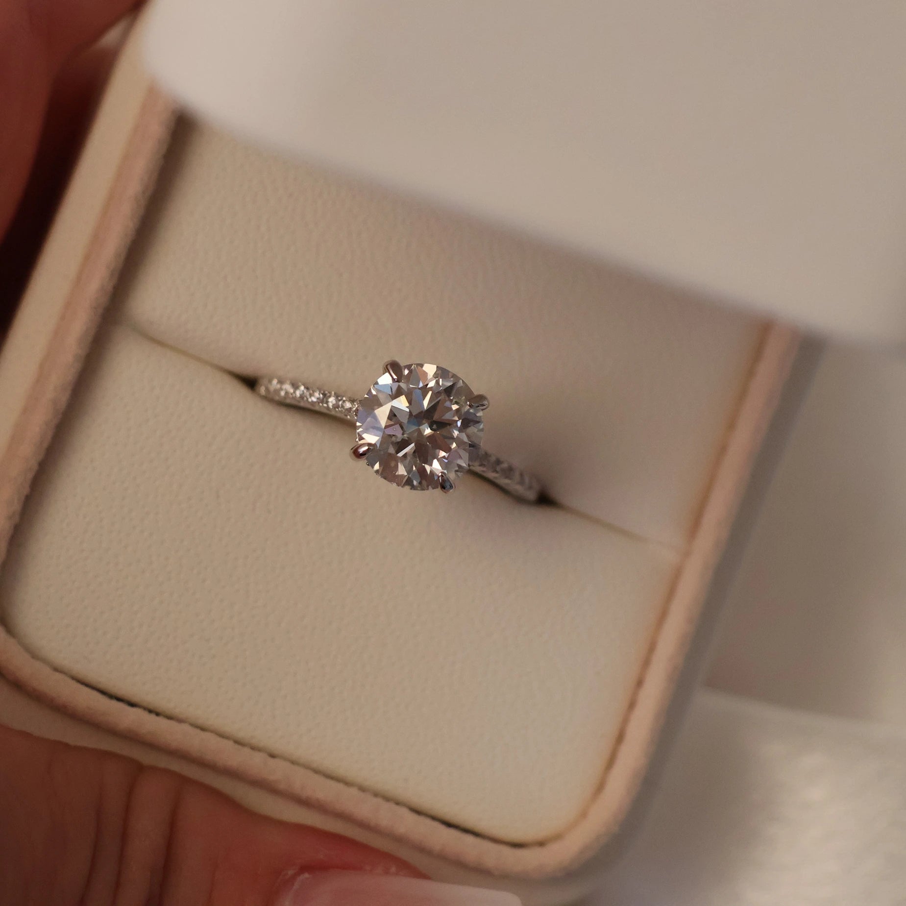 2 carat round cut moissanite ring with pave band
