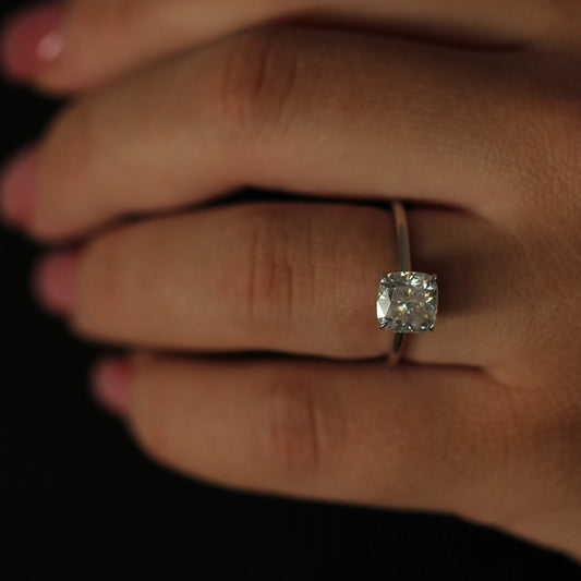 2ct cushion moissanite solitaire ring on hand