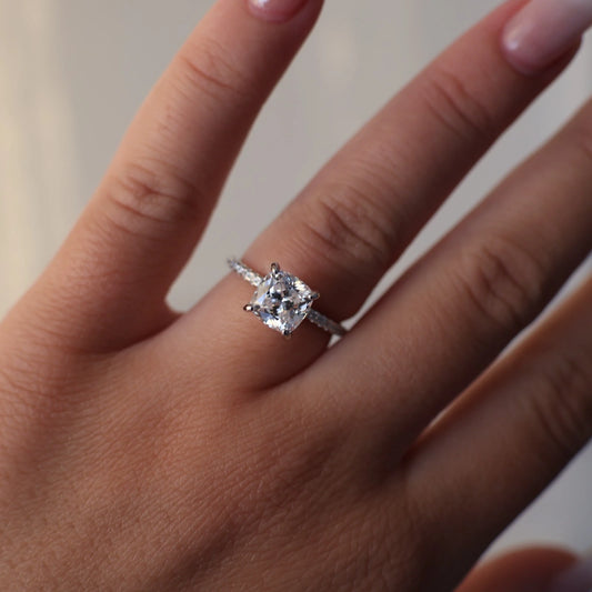 2 carat cushion cut cubic zirconia ring with a silver pavé band