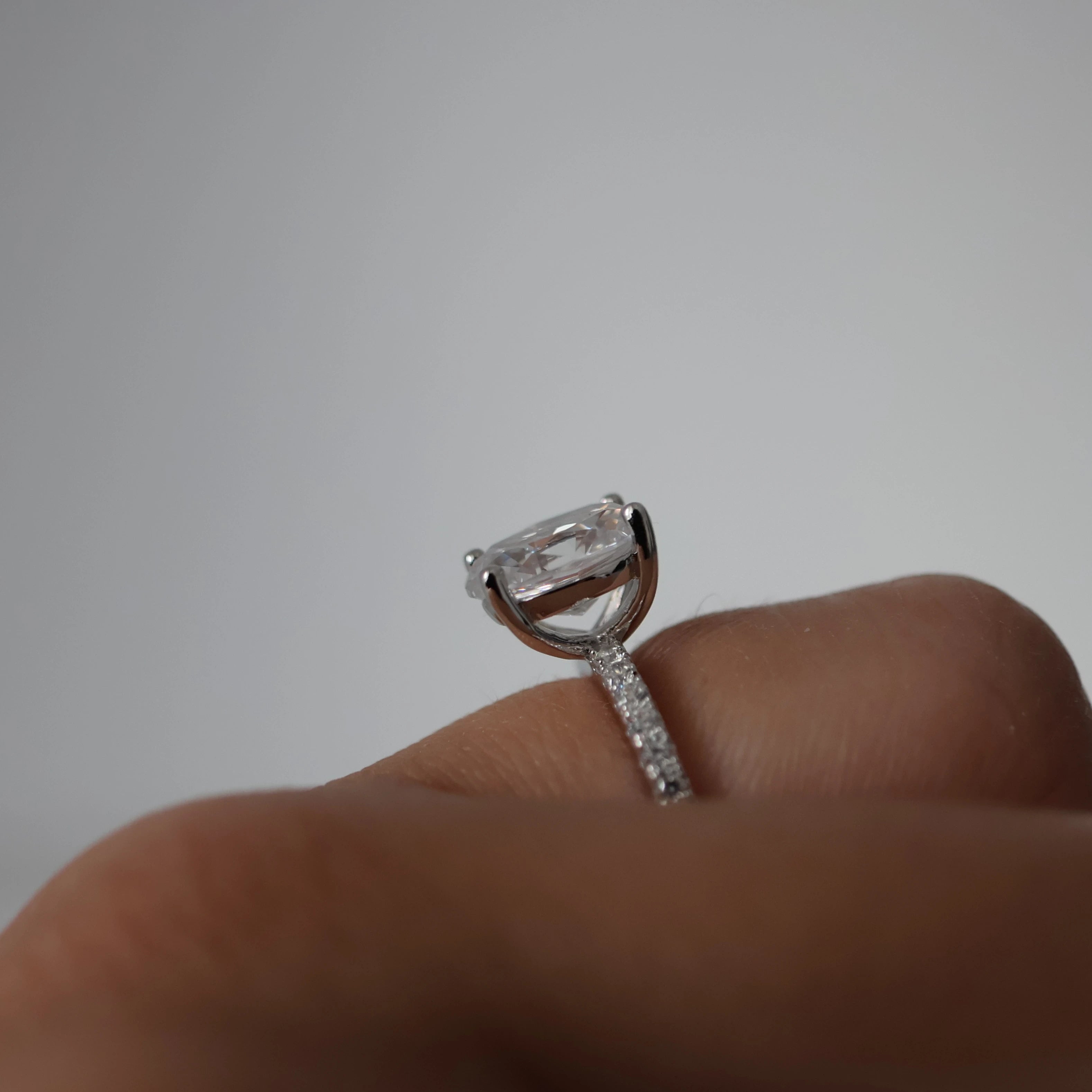 2 ct oval cubic zirconia ring with pavé band in silver