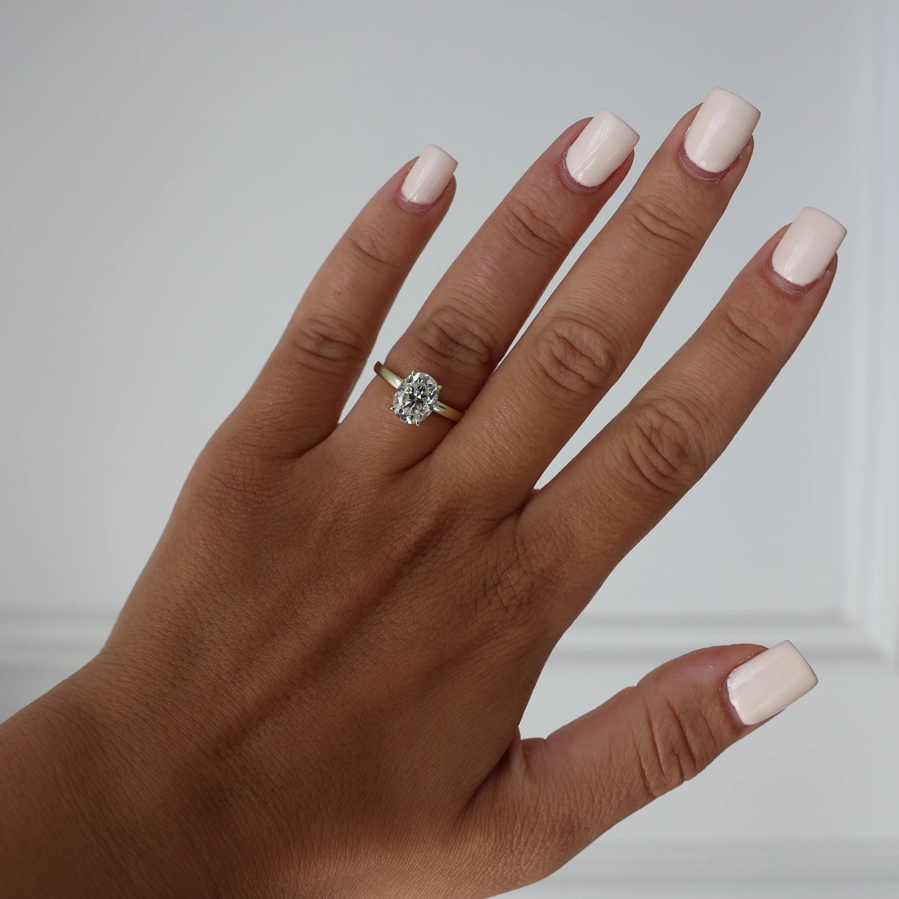 2 carat oval moissanite ring in a lighter 14k gold filled 