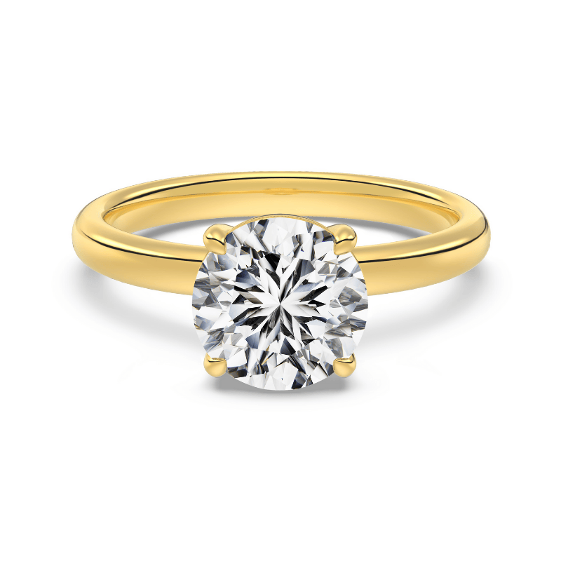 2 ct round gold engagement ring on white background