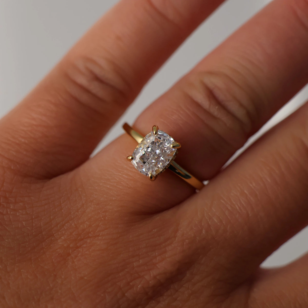 2.5 ct elongated cushion cubic zirconia engagement ring with hidden halo and 14K gold plating