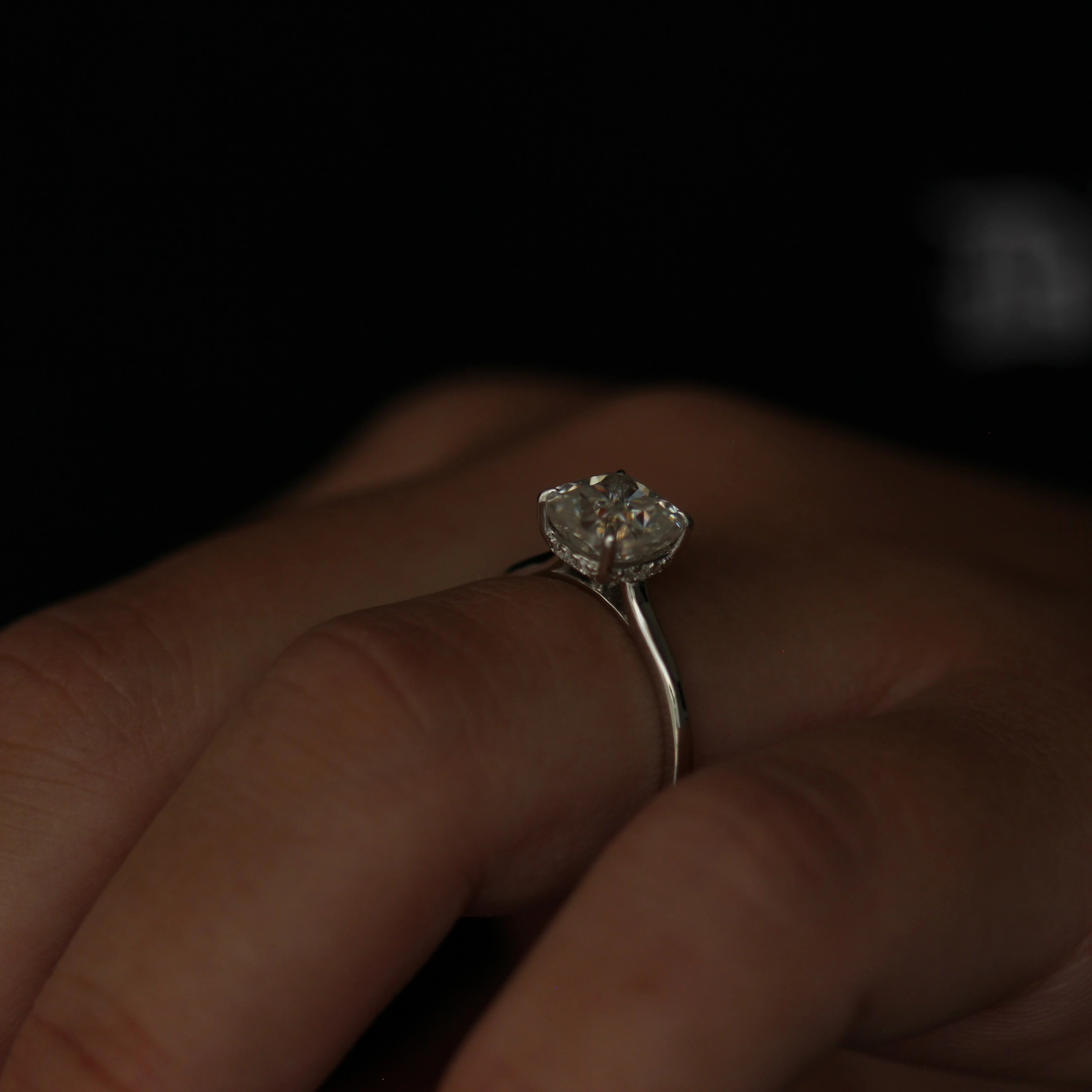 2 carat cushion cut moissanite hidden halo ring in silver side view