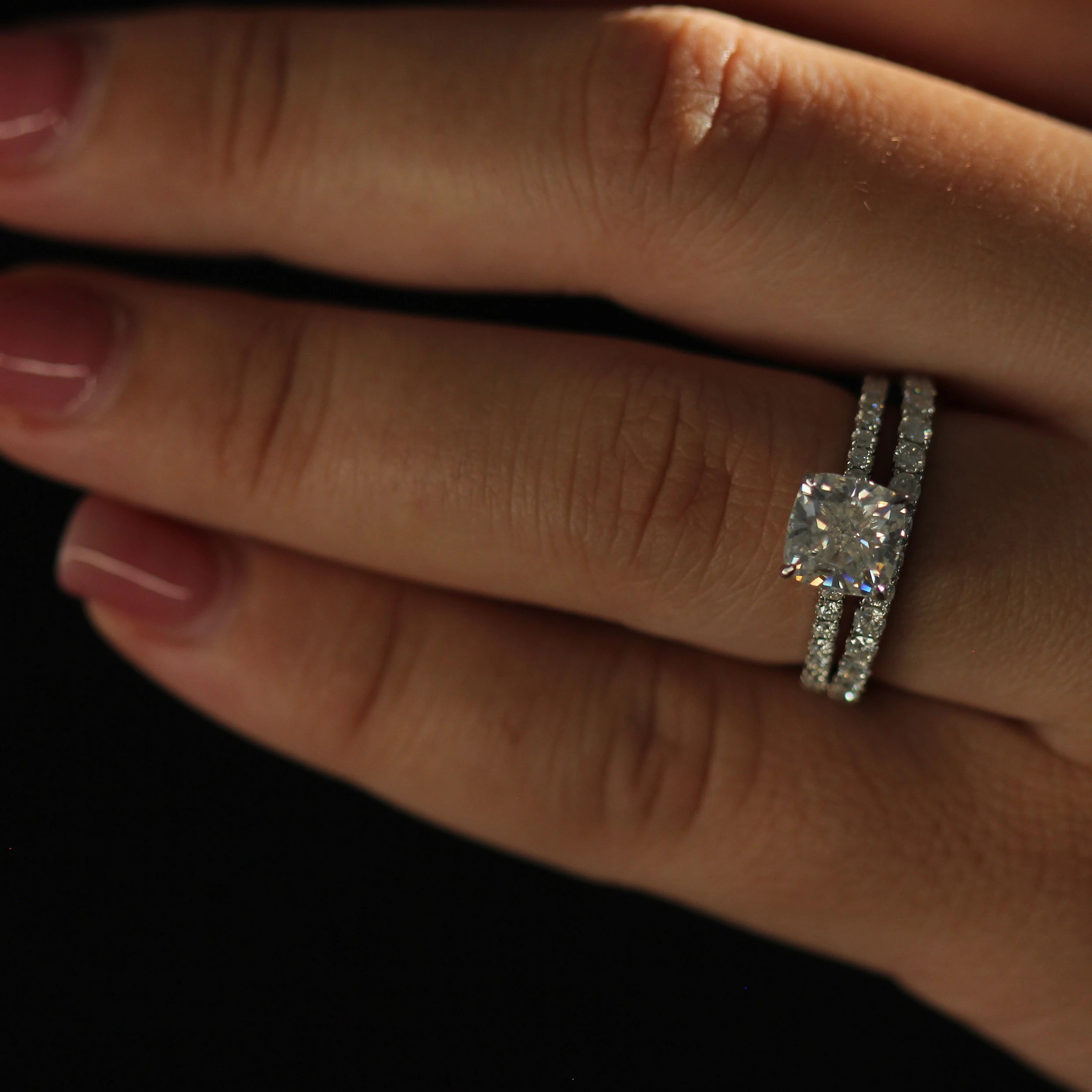 2 ct cushion cut moissanite ring on pavé band