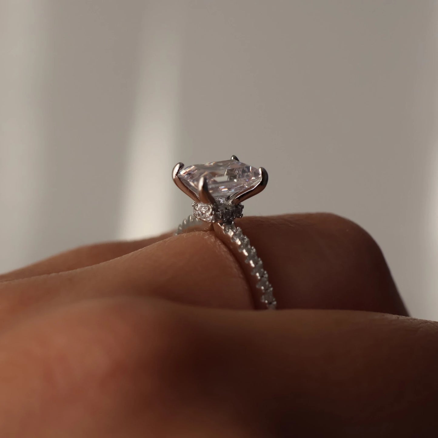 2 carat emerald cubic zirconia silver ring with hidden halo and pave band