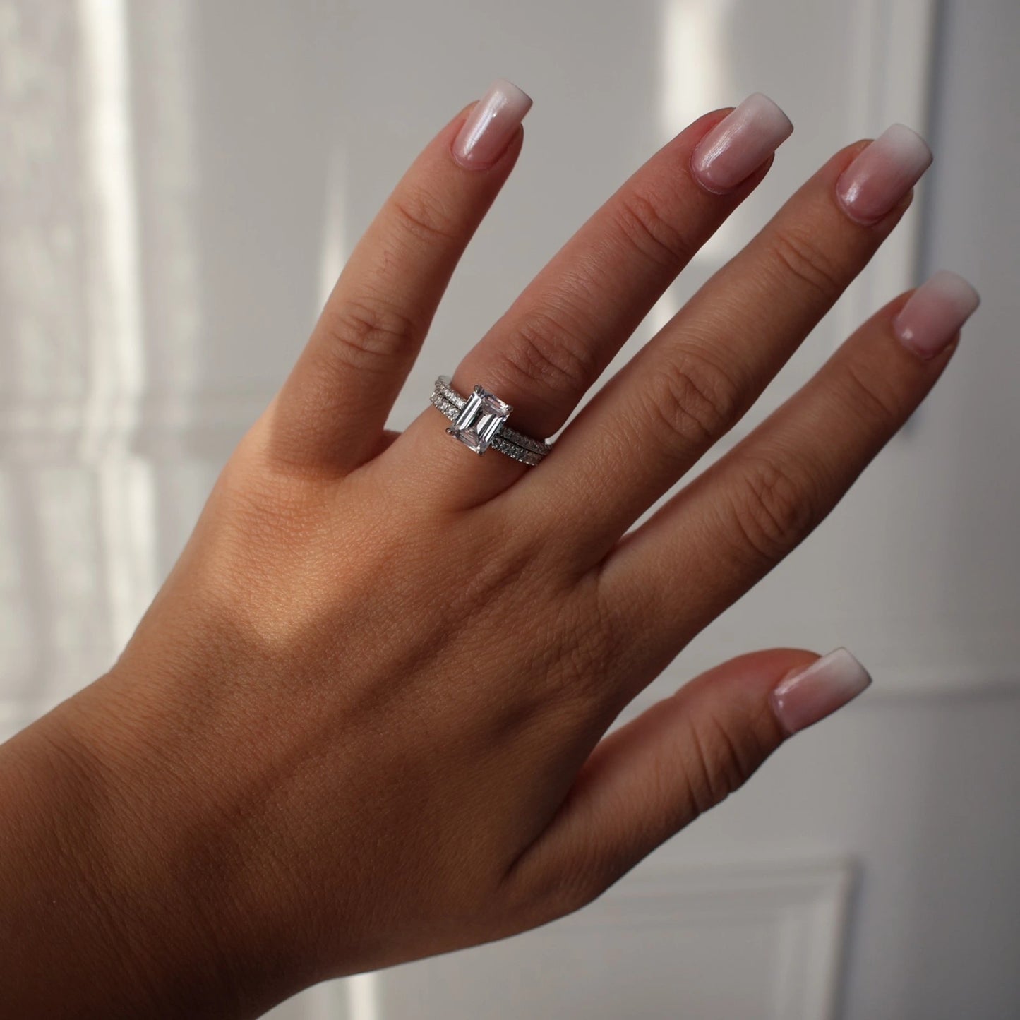 2 carat emerald cut cubic zirconia silver ring with hidden halo stacked with pave band