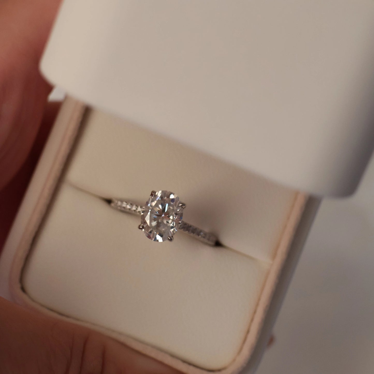 2ct oval moissanite ring with hidden halo and pave band