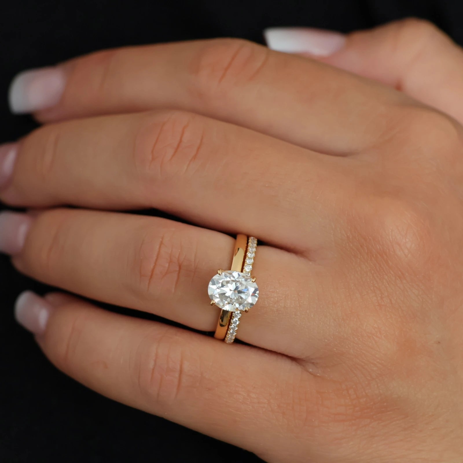 2 carat oval moissanite solitaire ring in 14k gold filled stacked with eternity band