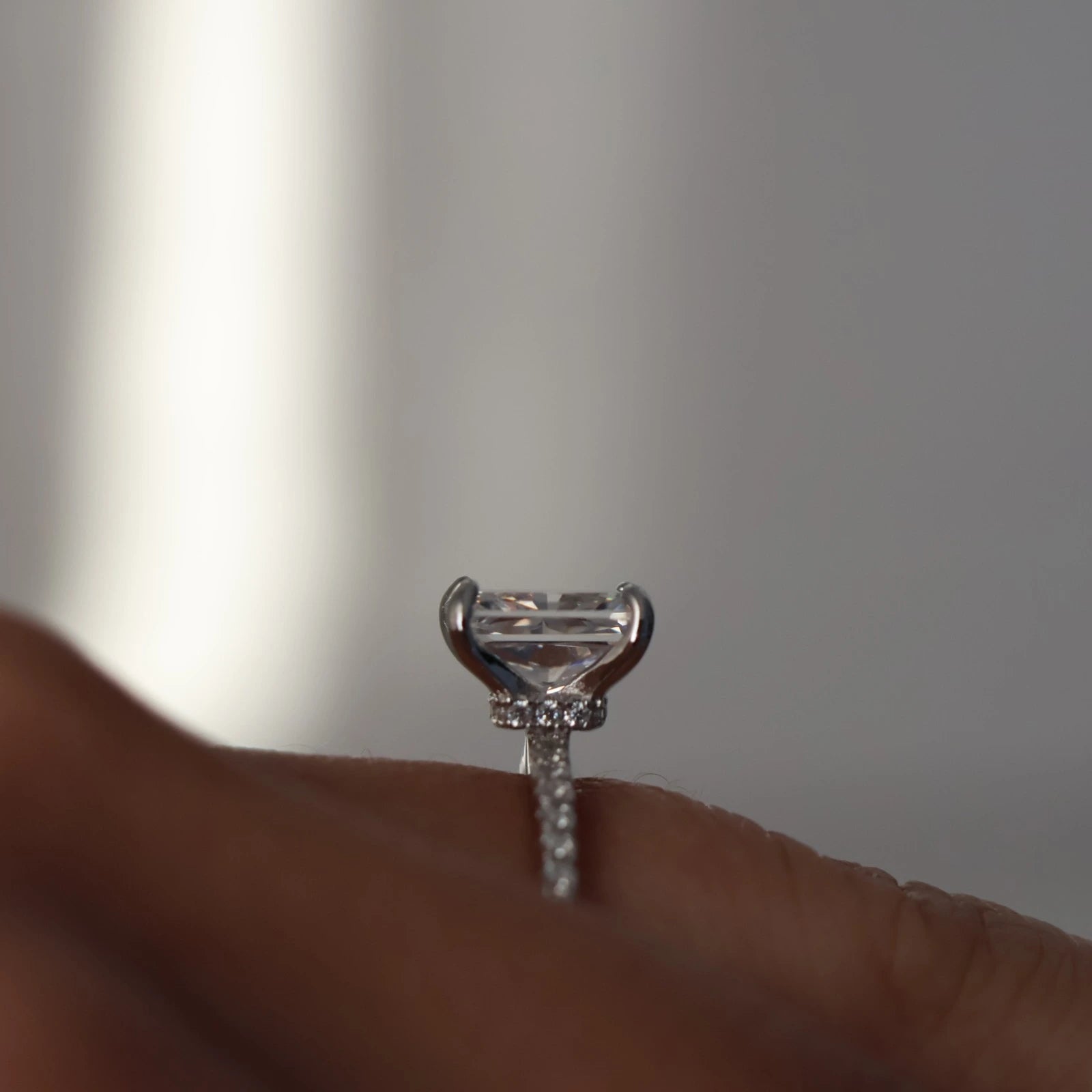 2 carat radiant cut CZ ring with hidden halo and pavé band