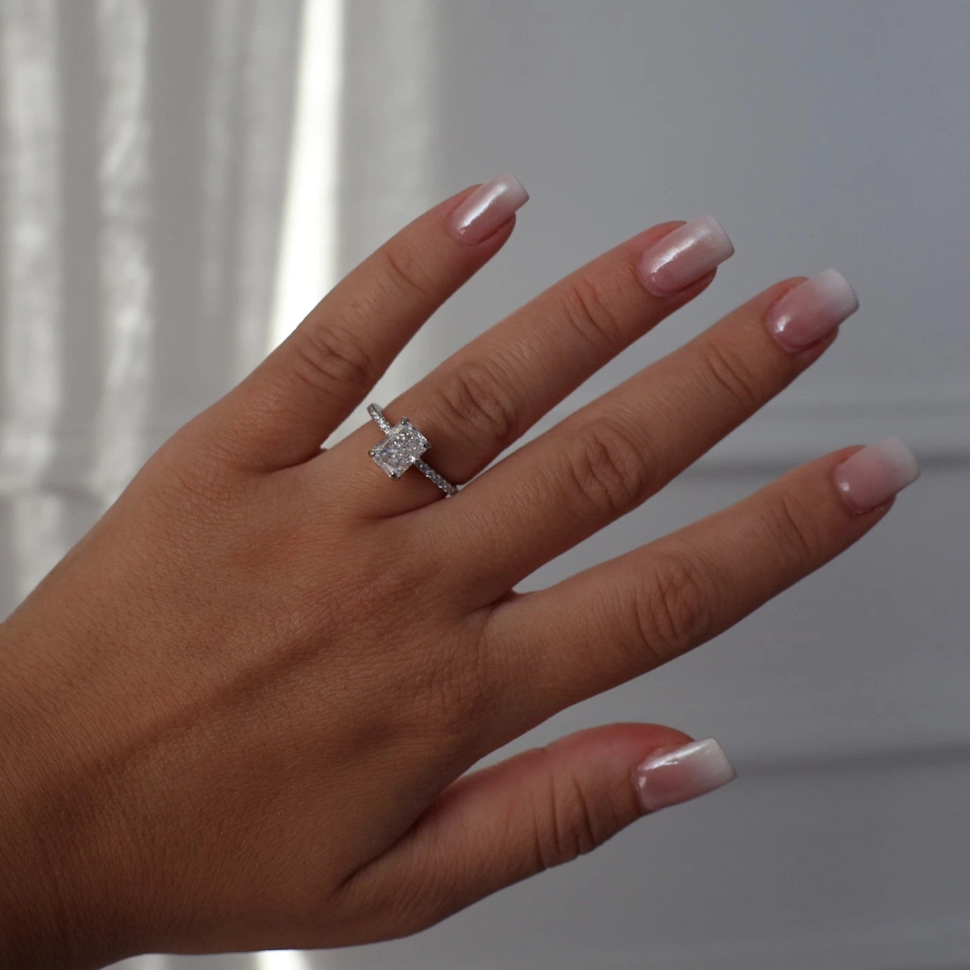 2 carat radiant cut CZ silver ring with pavé band