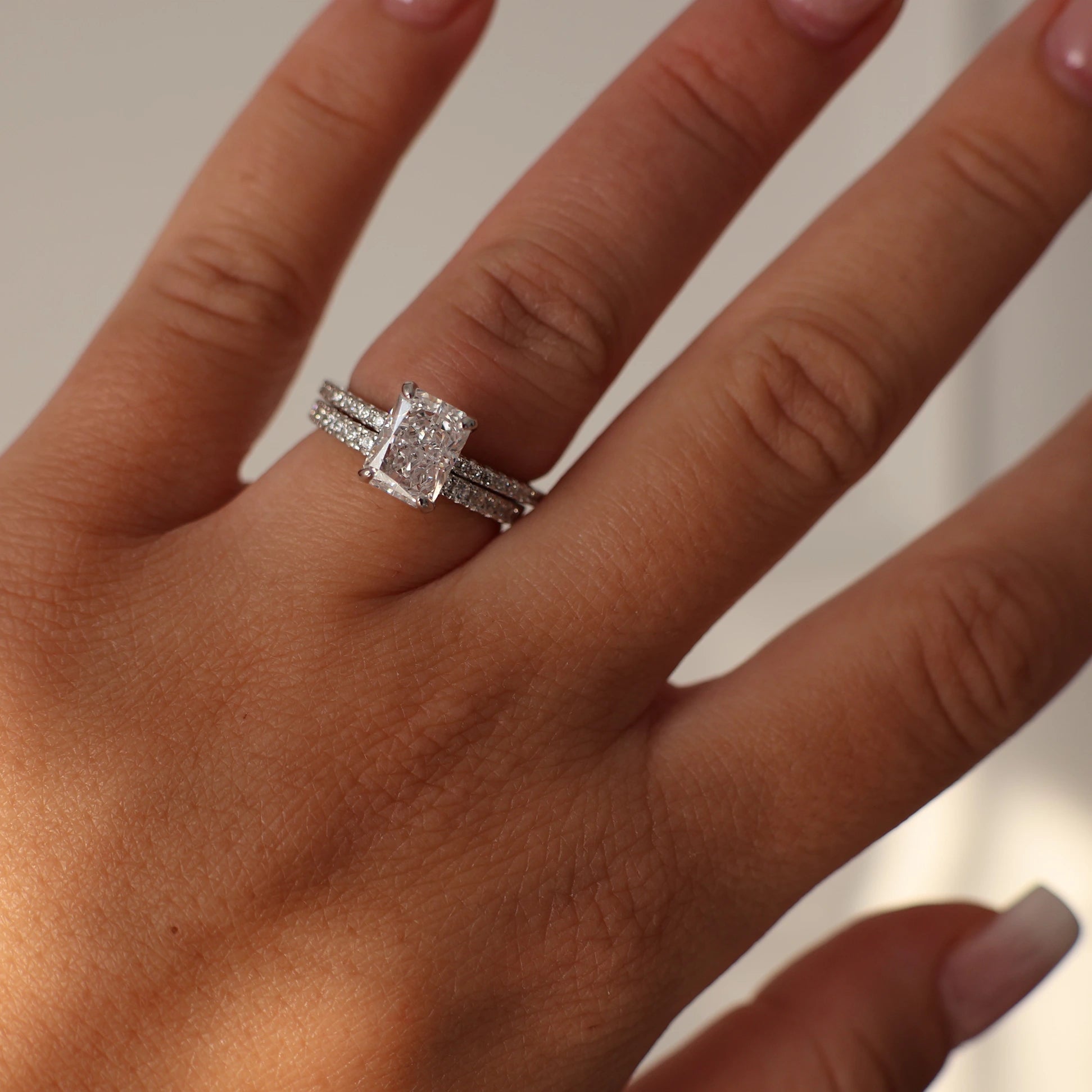 2 carat radiant cut cubic zirconia ring with pavé silver band