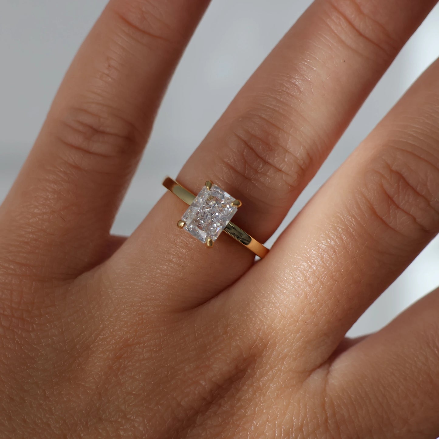 2ct radiant cut CZ solitaire ring with gold band