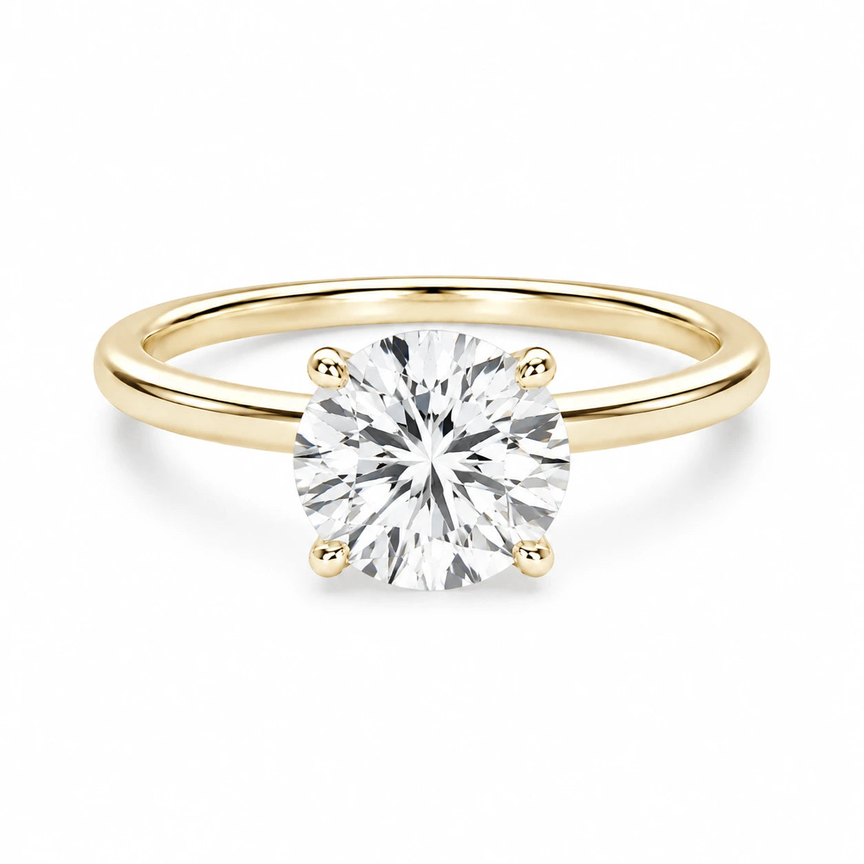 2 ct round gold engagement ring on white background