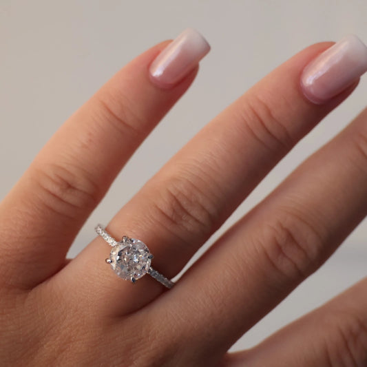 2 carat round cut ring with a silver pavé band 