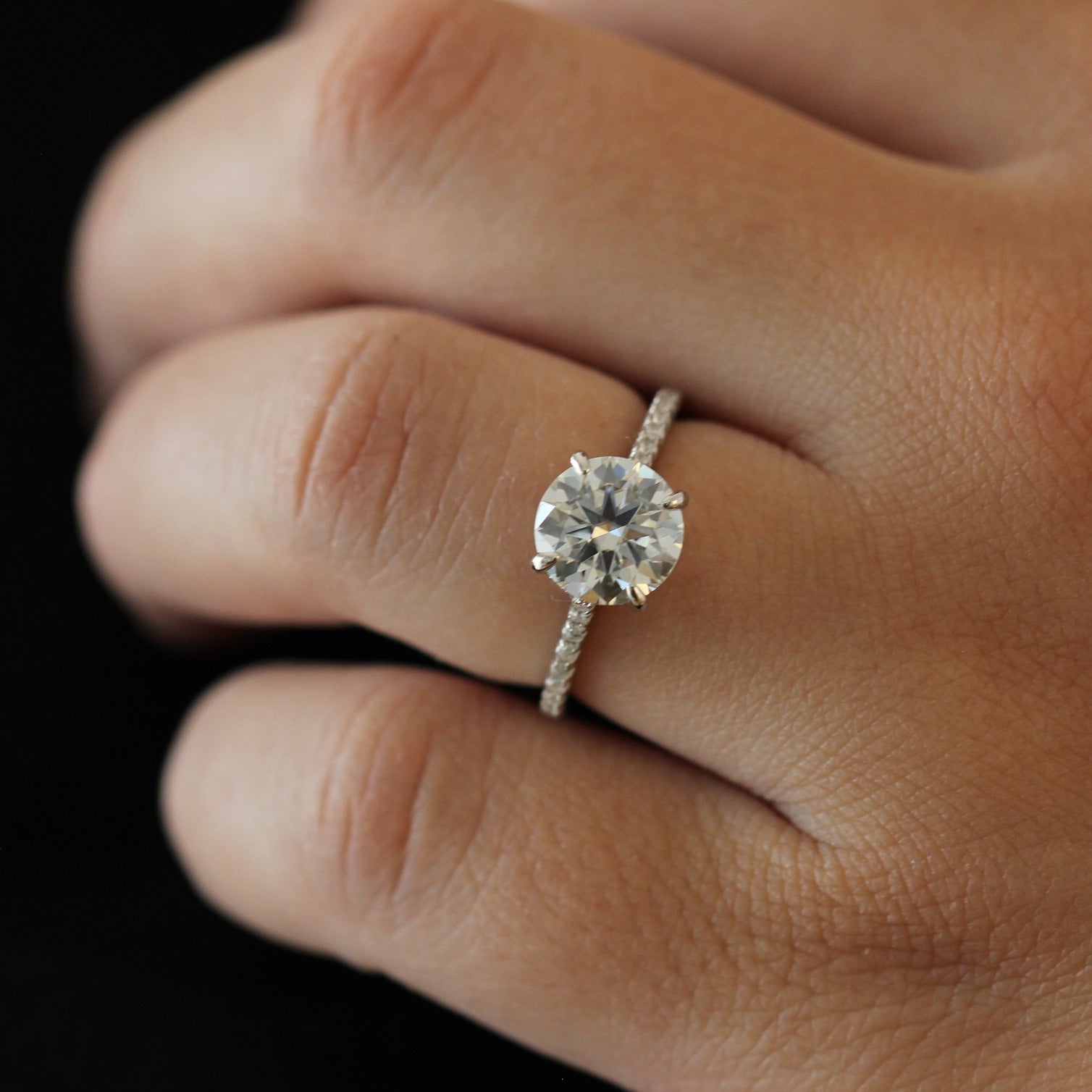 2 carat round moissanite ring with a pavé band