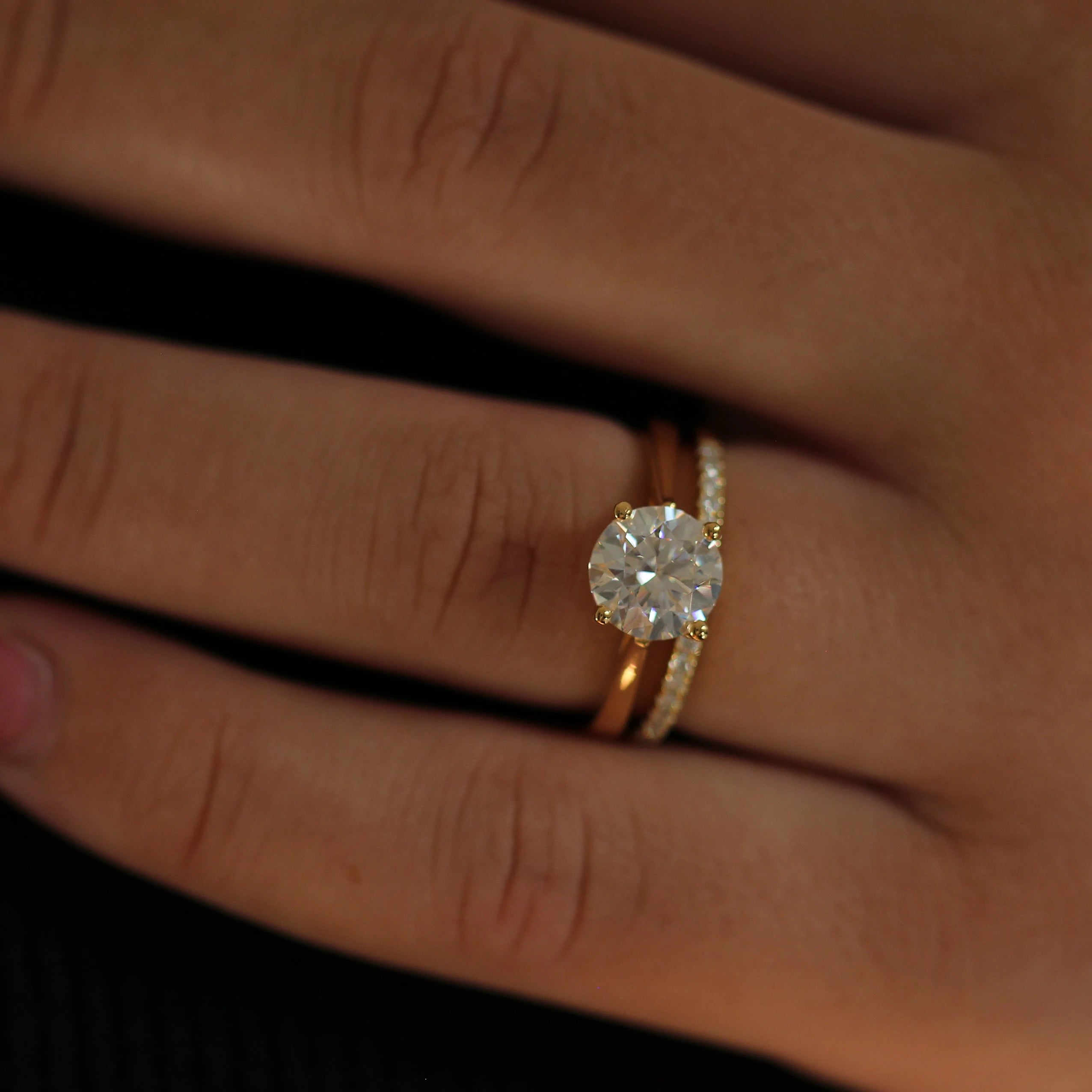 2 carat round moissanite ring in 14k gold filled setting stacked with pavé wedding band