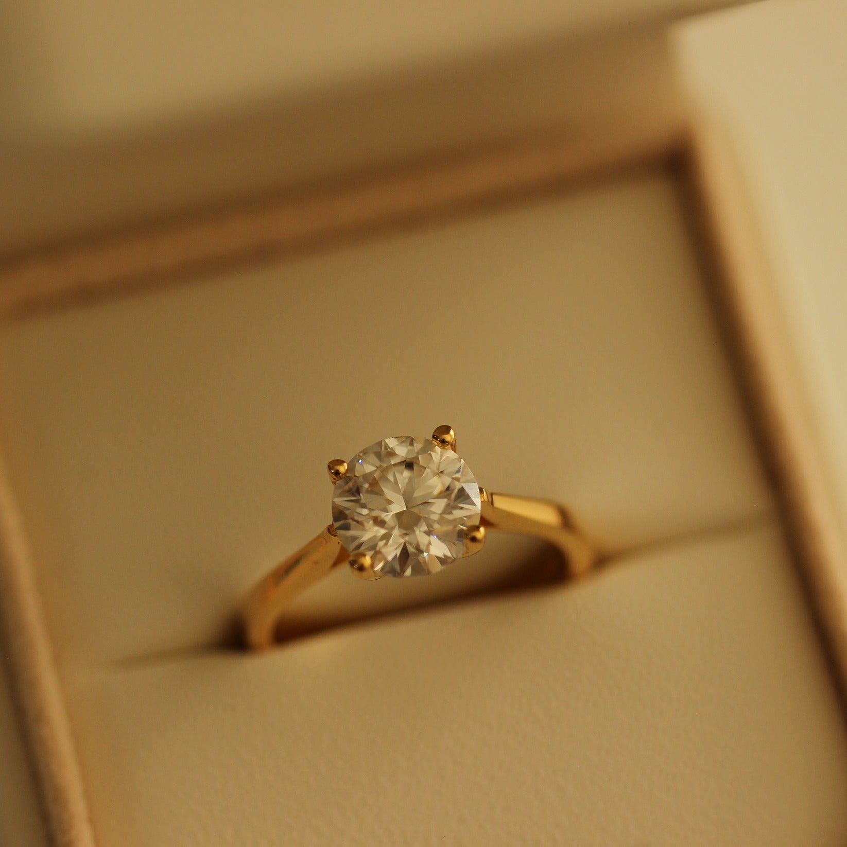 2 carat round solitaire moissanite ring with a 14k gold filled in proposal ring box