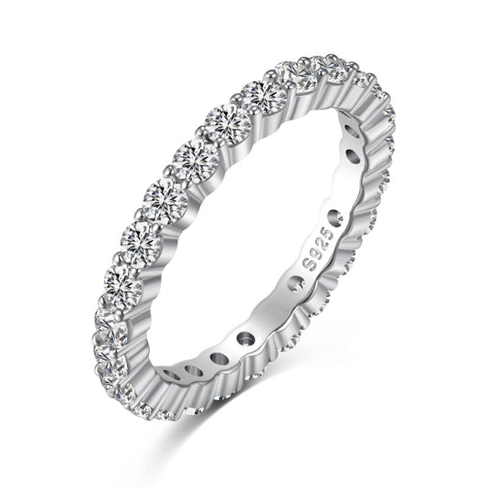 2mm silver eternity band with solitaire stones shown at a diagonal angle on a white background