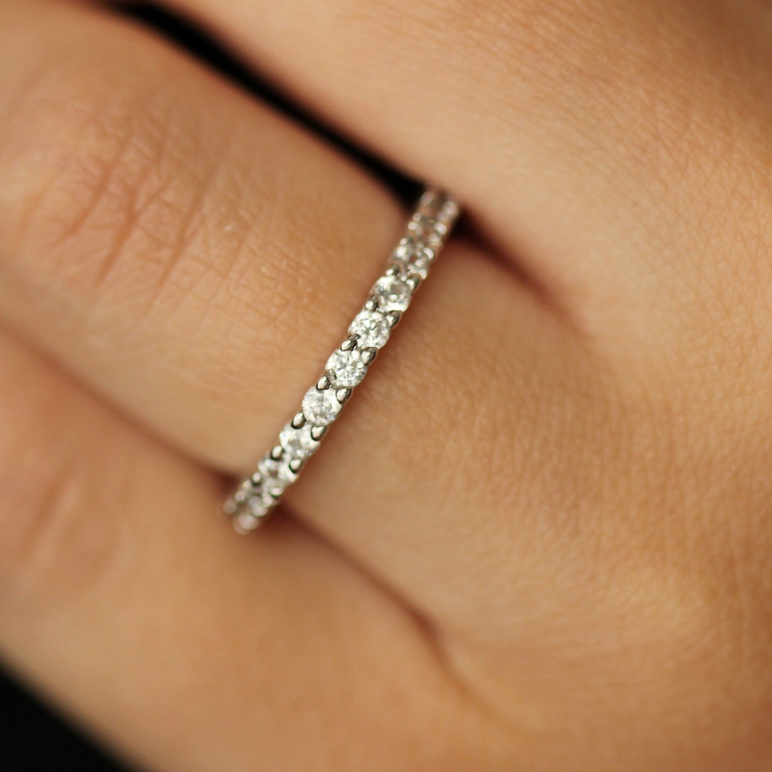 cubic zirconia silver eternity band on hand