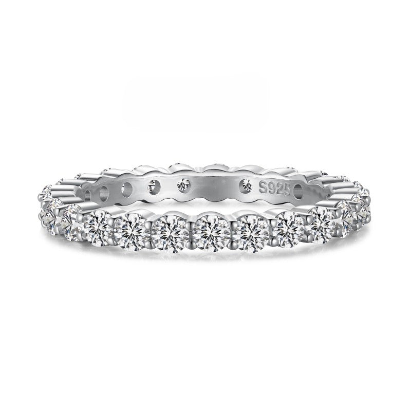 2mm silver eternity band with solitaire stones on white background