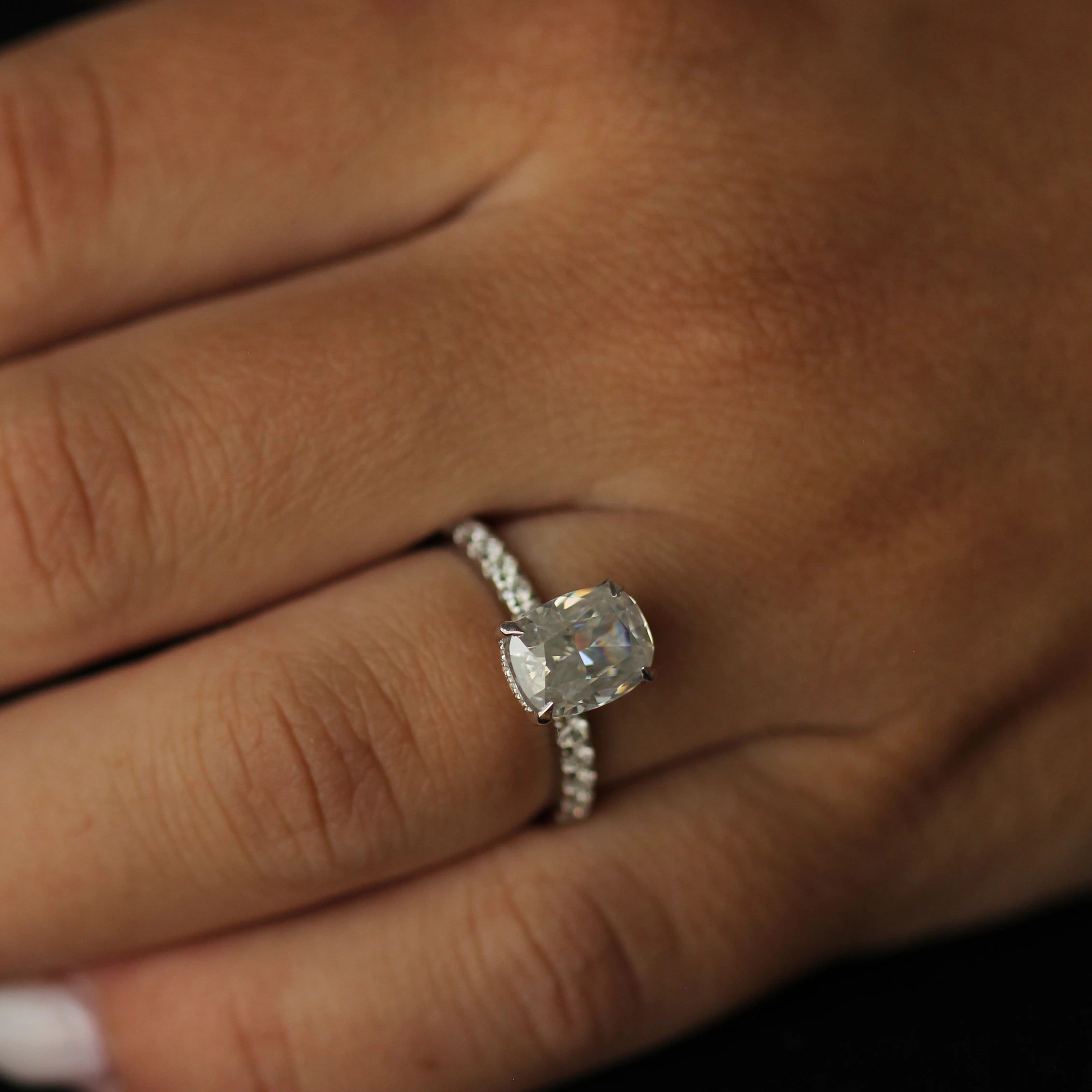 top view of 3 ct elongated cushion moissanite ring on hand