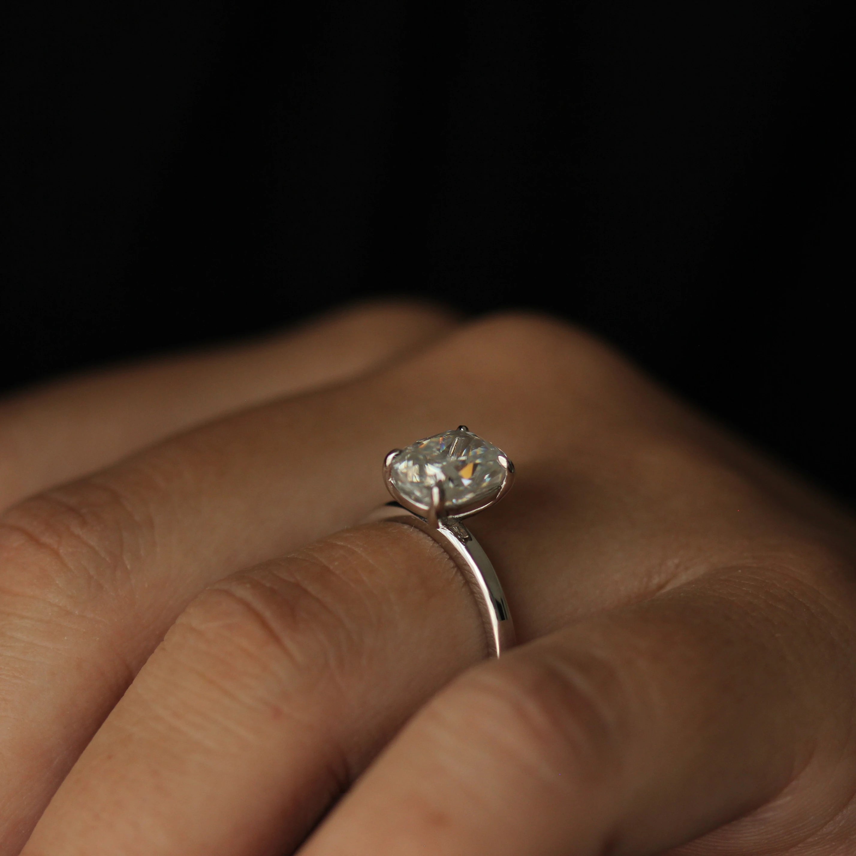 side view of 3 carat elongated cushion moissanite solitaire