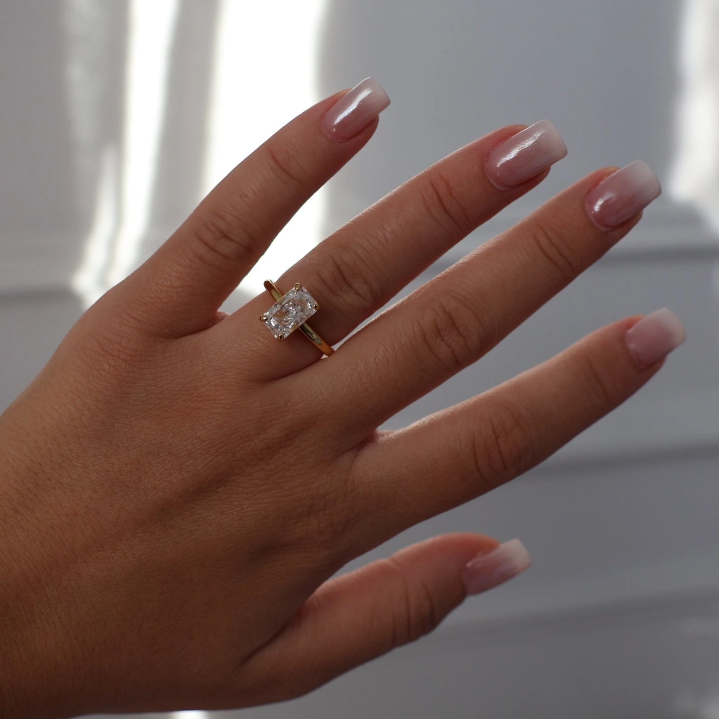 3 carat elongated radiant cut ring in gold