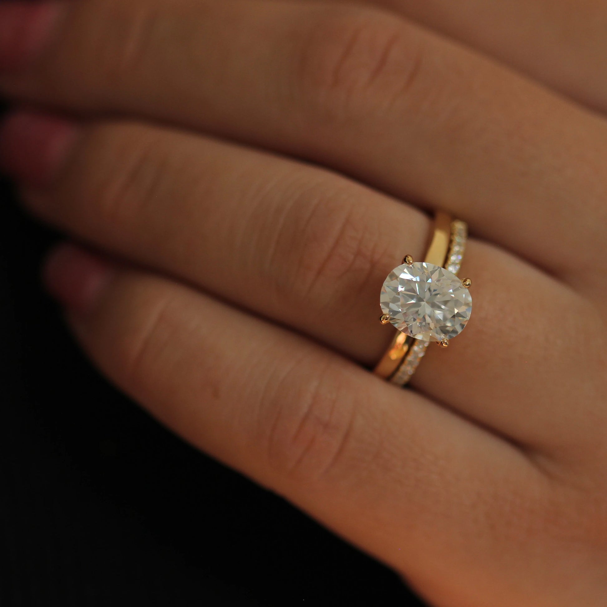 3 carat oval moissanite engagement ring in 14k gold filled stacked with half eternity band