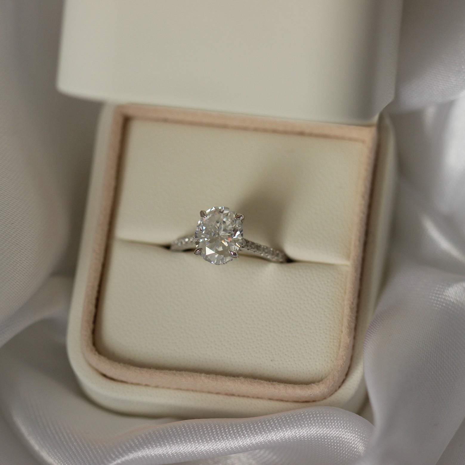 3 carat oval-cut moissanite wedding ring with pavé band