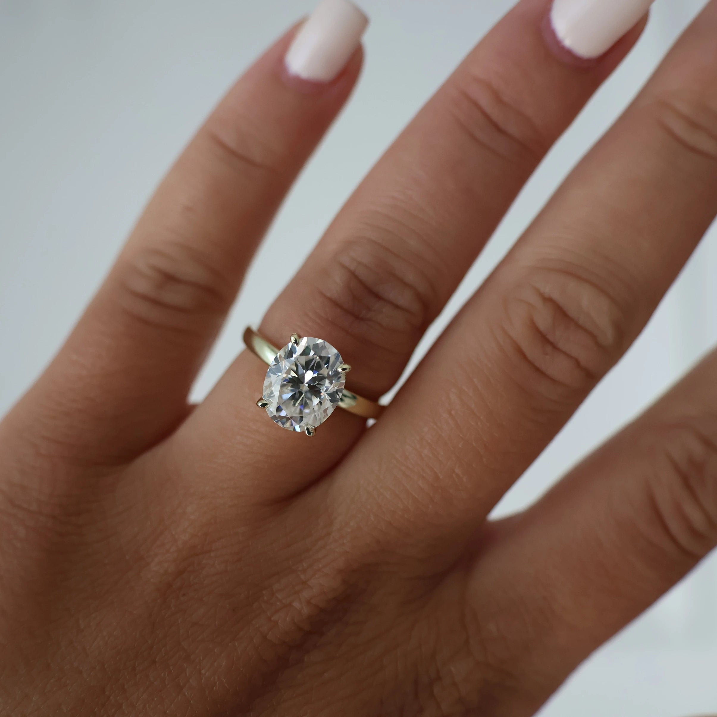 3 carat oval moissanite ring in a light 14k gold fill