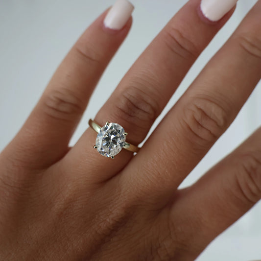 3 carat oval moissanite ring in a light 14k gold fill