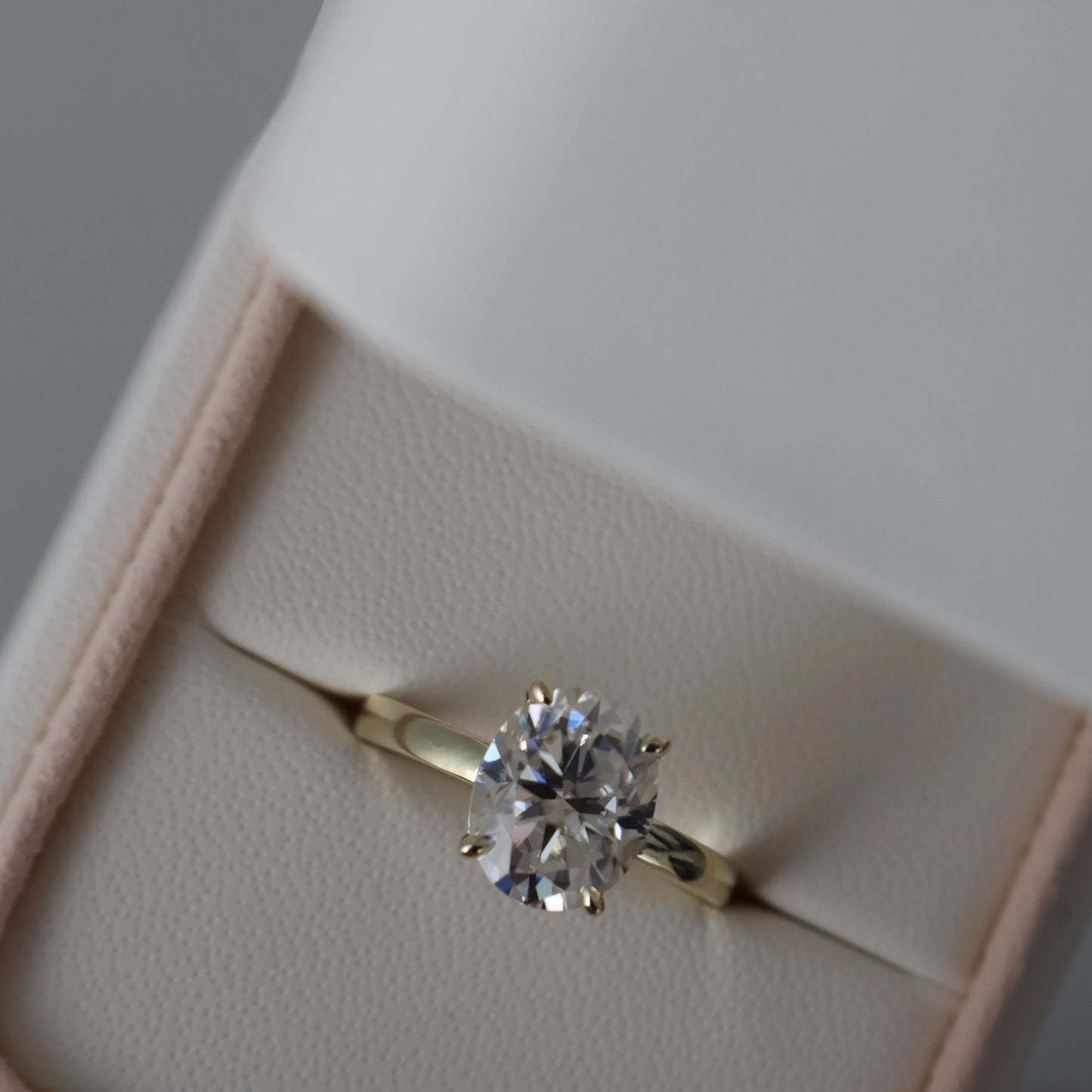 3 carat oval moissanite ring in soft yellow gold