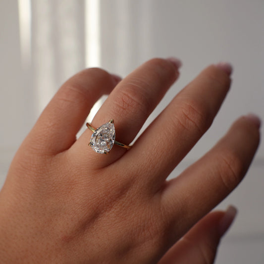 3 carat pear solitaire ring in gold with cubic zirconia stone
