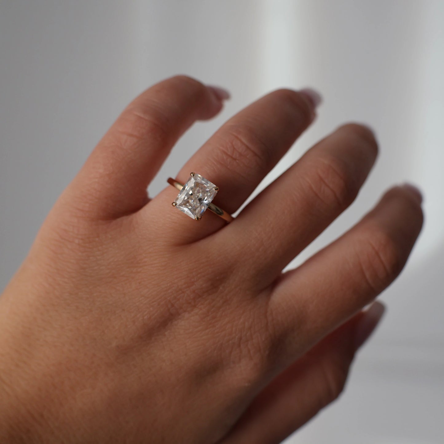 3 carat radiant cut moissanite ring in 14k gold filled with hidden halo