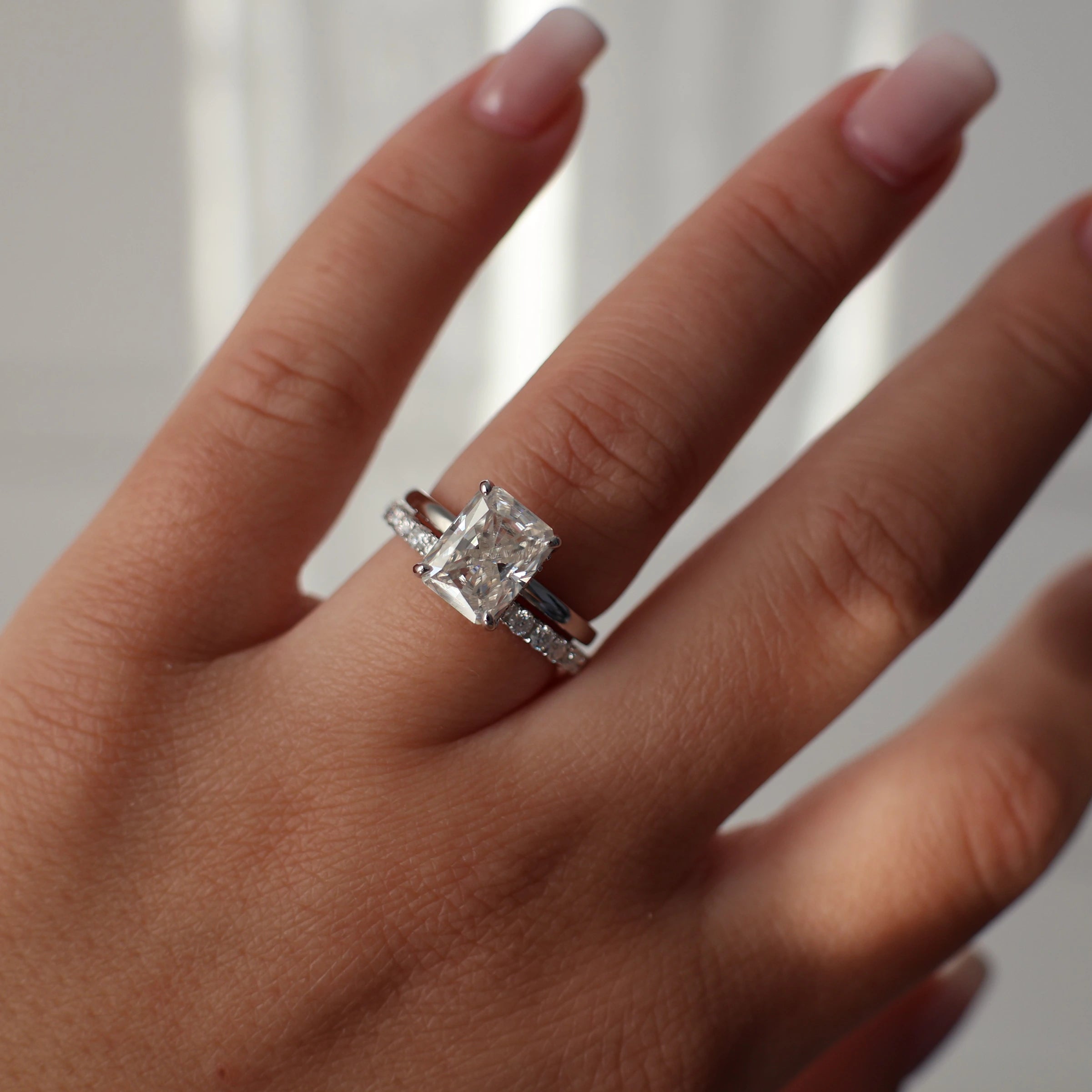 3 carat radiant cut moissanite ring in silver with a hidden halo