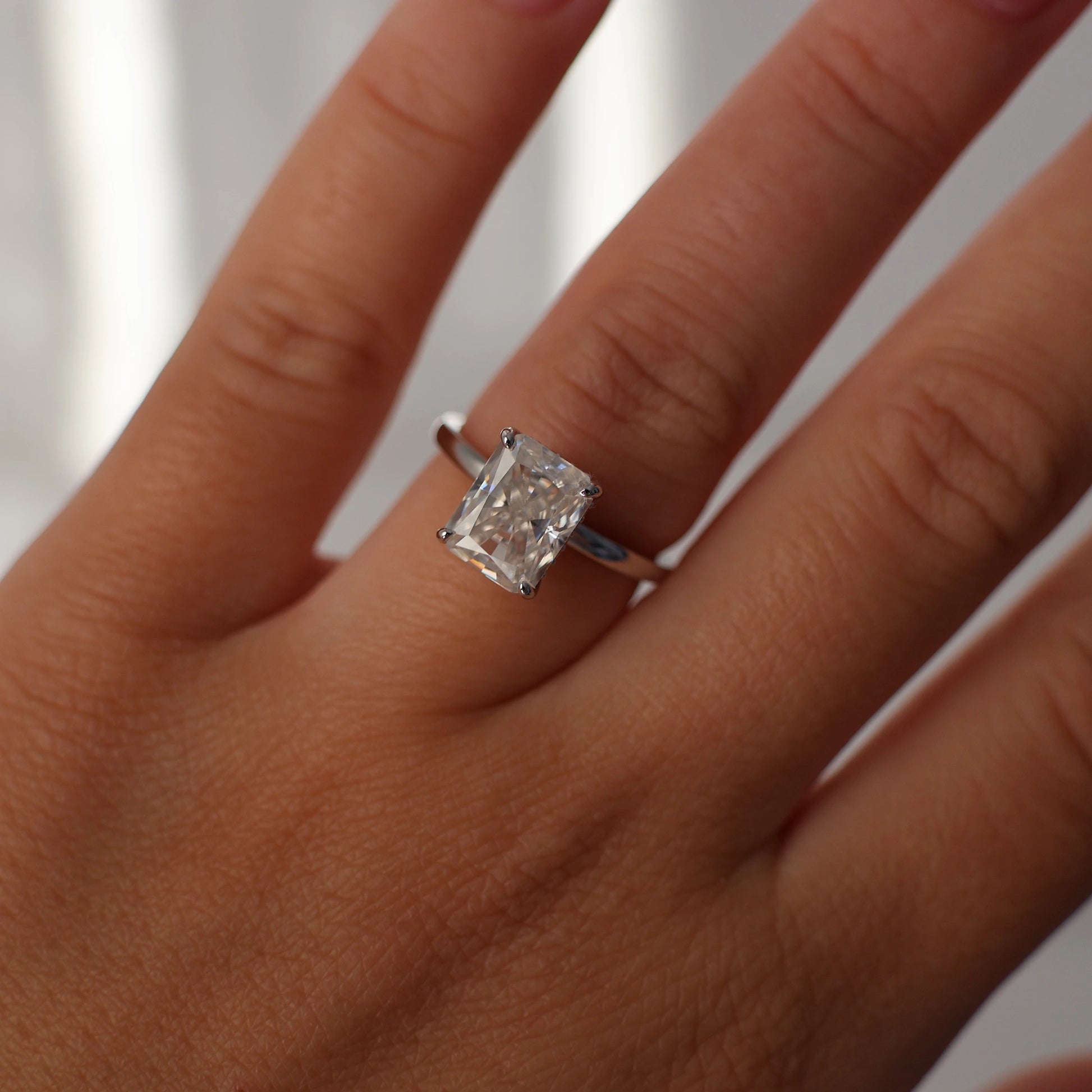 3 carat radiant cut moissanite engagement ring in silver with hidden halo