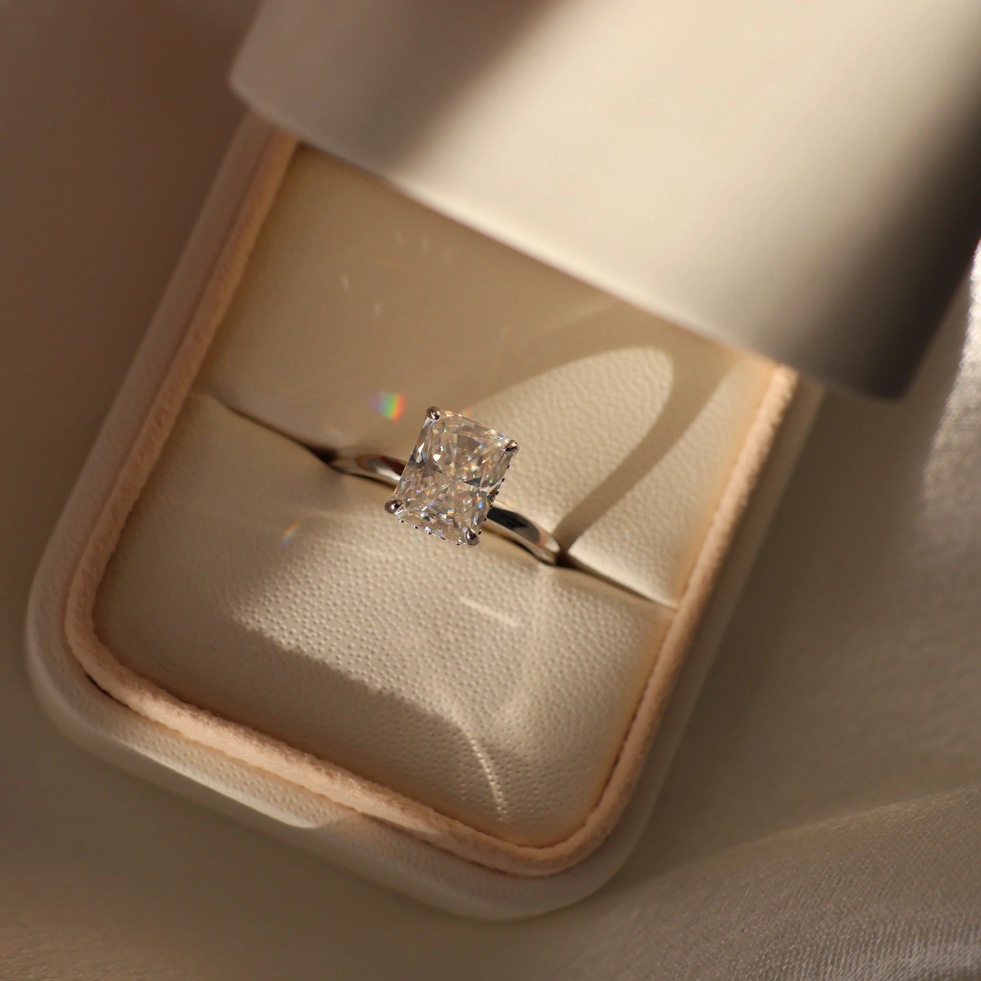 3 carat radiant cut moissanite ring in a proposal box